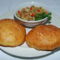 Bake & Saltfish · One Fry bake made from flour and stuffed in a bed of seasoned codfish and vegetables. 