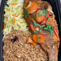 Whole Red Snapper Fish dinner · A whole red snapper seasoned & marinated with Caribbean herbs & spices, fried & smothered wi...