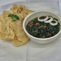 Roti with Spinach · Pita style Caribbean bread, cooked on a thin metal plate and served with sautéed spinach wit...