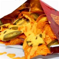 Dori Nachos · Doritos nacho bag served with melted cheese and jalapenos. Tasteful snacks suited to satisfy...
