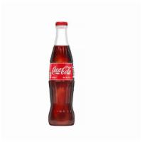 Coca Cola · Glass bottle. Mexican produced and imported. Thirst eliminating natural beverages made fresh...