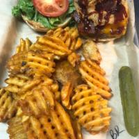 Bull Rider · Choice of protein, topped with cheddar cheese, onion rings and BBQ sauce. Served with lettuc...