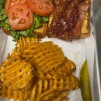 BLT · Toasted Texas toast with Bacon, Lettuce, and tomato. Served with pickle spear and fries.