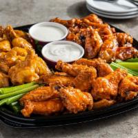 Party Buffalo Wings With Fries · Served with Fries and choice of preparation sauce .