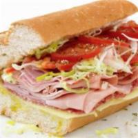 Italian Submarine · Hard salami, imported ham, provolone, lettuce, oregano, garlic salt, onions, spiced oil and ...