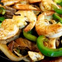Fajita Mixta · Shrimp, beef and chicken. Includes green peppers and onions, served with side of rice, beans...