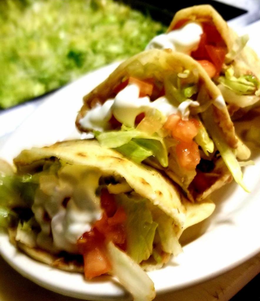 Gorditas de Asada  · Grilled beef. Homemade tortilla served with refried beans, lettuce, tomato, sour cream.