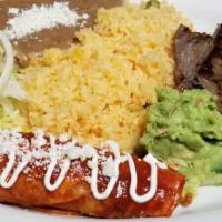 Carne Asada A La Tampiquena · Grilled beef slices tampico style with guacamole and cheese and onion enchilada.