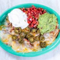 Nachos · Melted cheese, refried or black beans, sour cream, guacamole and pico de gallo on fresh tort...