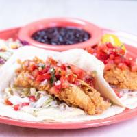Baja Fish Tacos · Beer-battered fresh fish wrapped in a warm flour tortillas and served with our homemade tart...