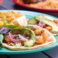Shrimp Tacos del Mar · Grilled marinated shrimp served open-faced on corn tortillas with pickled onion, tomatillo s...
