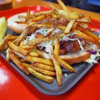 The KC Boy · Open face, smoked, Polish sausage sandwich with slaw and fries on top.