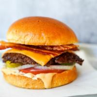 Smash Shack Bacon Cheeseburger · Juicy, grilled beef burger smashed to perfection with American cheese, smoked bacon, fresh s...