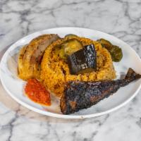 Tchepp Yapp · Senegalese jollof rice served with roasted lamb and vegetables sauce.