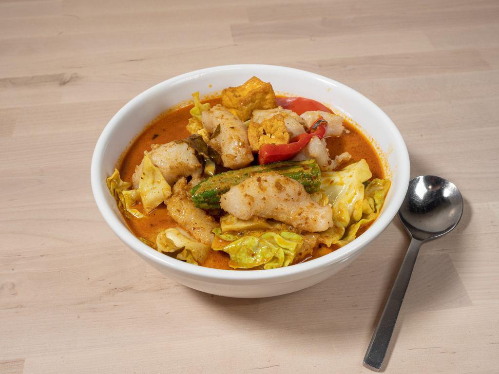 Swai Curry Soup · Swai fish, dry tofu, cabbage, red bell pepper, tomato, and string beans simmered in a stew of coconut milk, evaporated milk, curry and house spice blend.