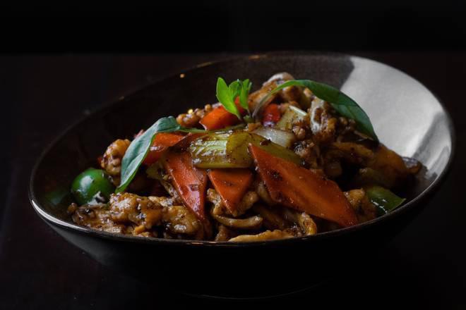 Black Pepper Chicken · Marinated chicken with onions, red and green bell peppers, celery, carrots, garlic, white wine, black bean sauce, soy sauce and black and white pepper.