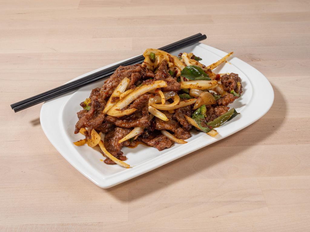 Golden Taste Lamb · Strips of tender lamb wok tossed with dry chili, shrimp powder, red pepper, garlic, onion, jalapeno, curry leaves, and lemongrass.
