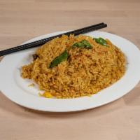 Curry Fried Rice · Lemongrass, garlic, turmeric, paprika, curry powder, blue ginger, curry leaves, and egg.