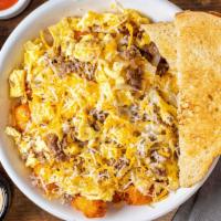 Philly Boy Scrambler · Eggs scrambled with ribeye steak, onions, hot peppers mix and mixed cheese on a bed of tater...