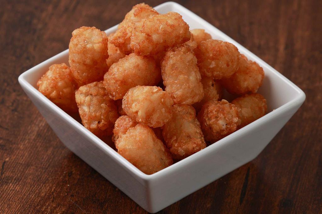 Tater Tots · A fan favorite, these classic tater tots are served gold-brown and crispy.