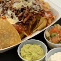 Nachos Supreme · Served with sour cream and guacamole. Choice of beef, chicken, or cheese. Add chile verde fo...