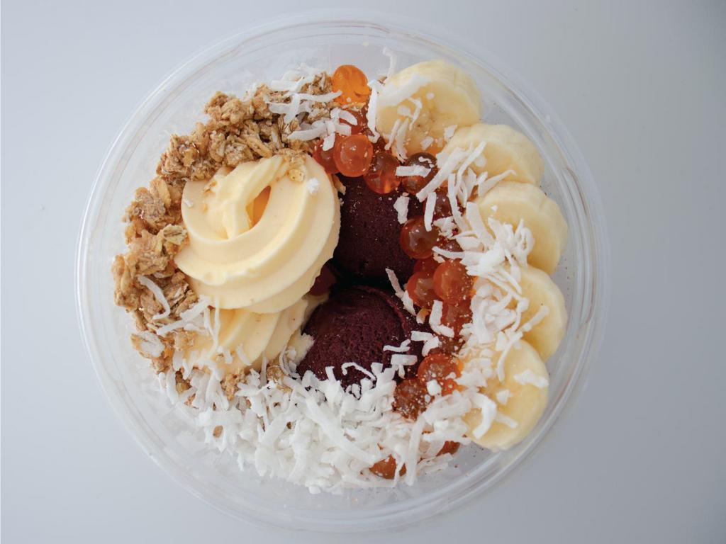 Tropicalicious Bowl · Life’s sweeter with this tropicalicious bowl. It’s made with organic acai, dairy-free pineapple sorbet, granola, bananas, pineapple, and coconut shreds.