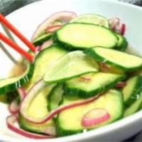 Cucumber Salad · Cucumber, red onion and carrots.