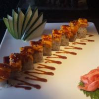 Red Dragon Maki · Shrimp tempura, jalapeno, avocado and unagi, topped with spicy tuna, tempura crunch and unag...