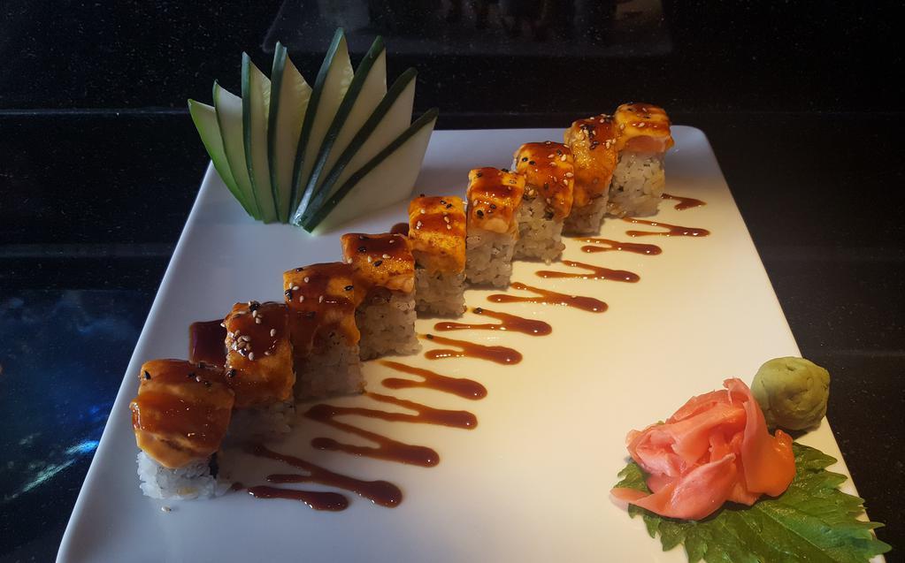 Red Dragon Maki · Shrimp tempura, jalapeno, avocado and unagi, topped with spicy tuna, tempura crunch and unagi sauce. 
