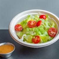 Chopped Salad · Iceberg lettuce and cherry tomatoes with red wine vinaigrette.