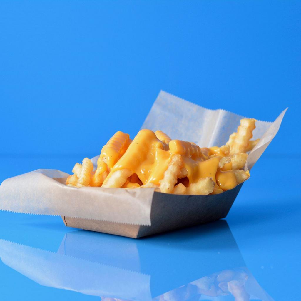 Cheese Fries · Waffle fries topped with melted American cheese sauce.