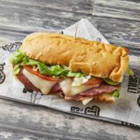 Tubby's Famous Sub · Cotta salami, genoa salami, ham, cheese, onions, lettuce, tomatoes and Tubby's famous dressi...