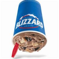 Oreo Cheesecake Blizzard® Treat · Oreo cookie pieces and cheesecake pieces, choco cookie crunch base blended with creamy DQ® v...