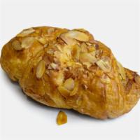 Croissants|Almond Croissant · A sweet butter croissant filled with a moist almond filling and topped with sliced almonds. ...