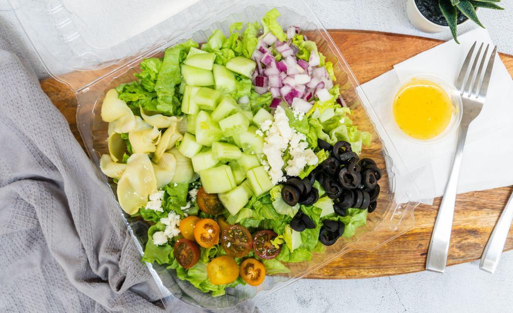 Greek Salad · Lettuce, cucumbers, cherry tomatoes, olives, onions, artichokes, Italian dressing.