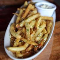 Truffle Fries · Truffle infused fries with Parmesan cheese and garlic aioli.