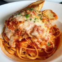 Chicken Parmesan · Fried chicken breast in tomato sauce with melted mozzarella served over penne or linguine an...