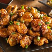 Orange Chicken · Battered and cooked in a sweet orange sauce. 