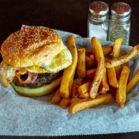 Breakfast Burger · 1/2 lb. Black Angus burger topped with a fried egg, tater tots and bacon. Served with choice...