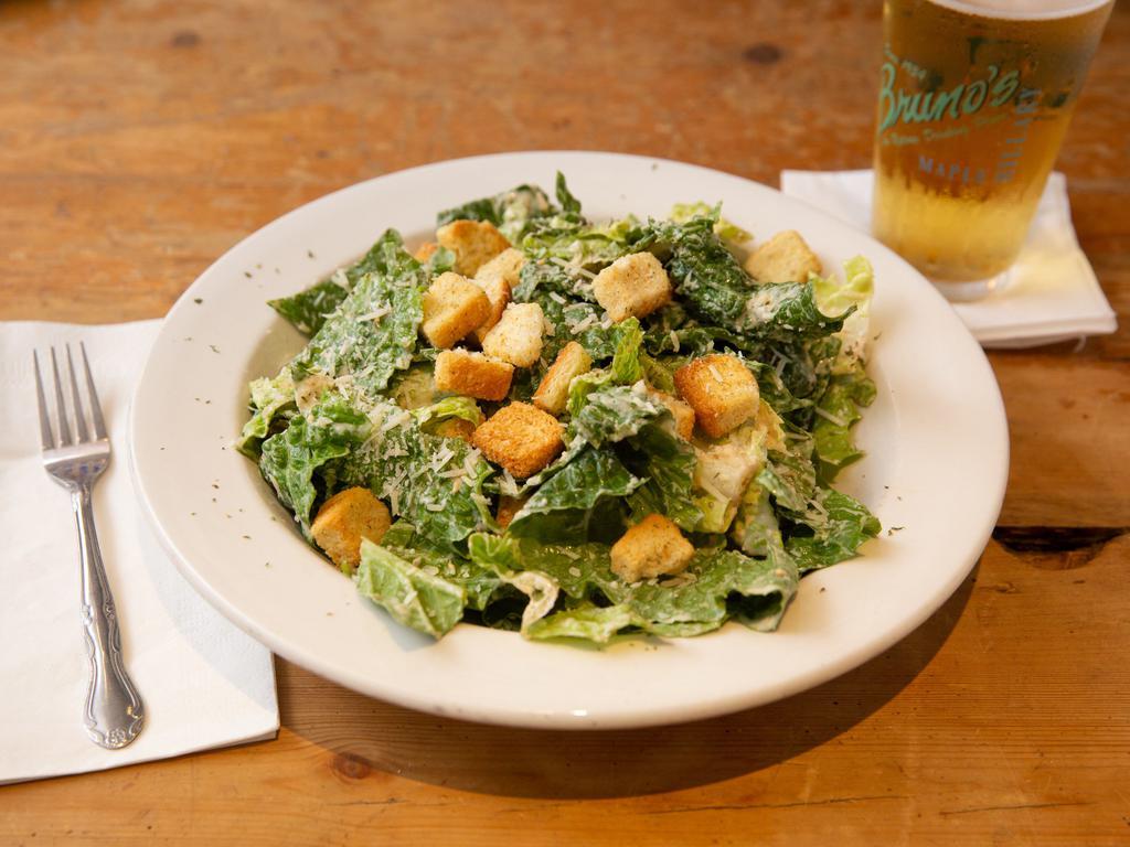 Caesar Salad · Fresh romaine lettuce tossed Caesar dressing and topped with Parmesan cheese and garlic croutons.
