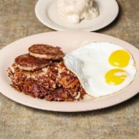Country Breakfast · 2 eggs, 2 sausage patties, hash browns and a warm biscuit smothered with gravy.