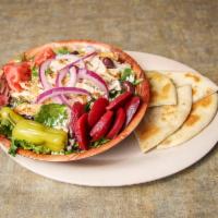 Greek Salad · Tossed greens, tomato, Greek olives, beets, sliced onions, pepperoncini, feta cheese and hom...