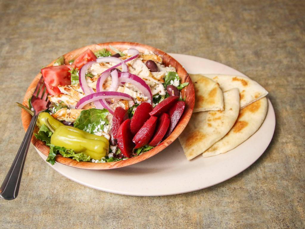 Greek Salad · Tossed greens, tomato, Greek olives, beets, sliced onions, pepperoncini, feta cheese and homemade Greek dressing. Served with grilled pita. 