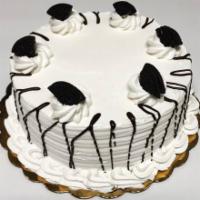 Large Oreo Ice Cream Cake · Chocolate cake with Oreo ice cream filling with whipped cream frosting and Oreo cookies topp...