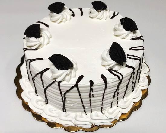 Large Oreo Ice Cream Cake · Chocolate cake with Oreo ice cream filling with whipped cream frosting and Oreo cookies topping. 