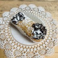Mini Chocolate Chip Cannoli · Regular cannoli shell filled with ricotta cream and chocolate chips.