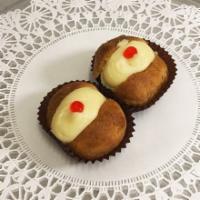 Mini Rum Baba Pastries · Rum soaked cake filled with traditional Italian cream.