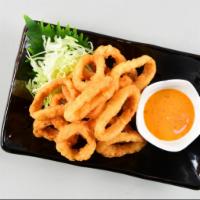 Fried Calamari · Deep-fried golden brown calamari served with spicy mayo sauce.