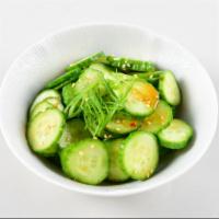 Cucumber Salad · Slice cucumbers with homemade sweet vinegar dressing top with sesame seed.