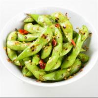 Spicy Edamame (V) · Young soybeans sauteed with butter, toasted chilies, sea salt, and roasted garlic.